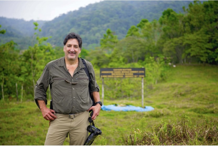 Rafael Gallo standing against the backdrop of his Pacuare reserve.
