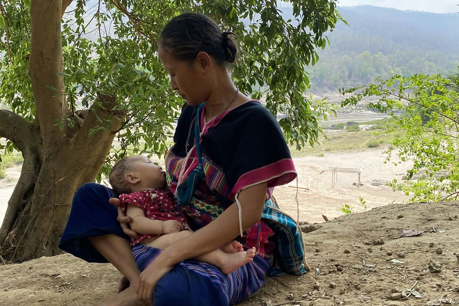 Karen Indigenous woman holds child