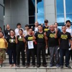 Members of the Thai Mekong People's Network from Eight Provinces stand outside the Thai court after the verdict, Aug. 17, 2022